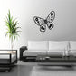 Black dotted butterfly in flight wall decal with outlined wings