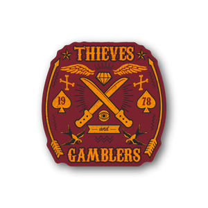 Vinyl sticker with purple shield graphic, crossed swords, cards, and Thieves Gamblers text