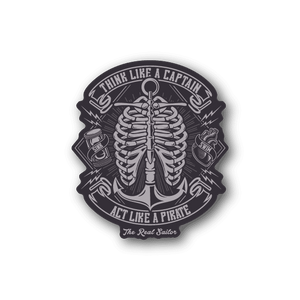 Round vinyl sticker with skeleton hands and captain/pirate text, dark gray and white