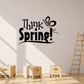 Black wall decal reading 'Think Spring!' with butterfly flourish