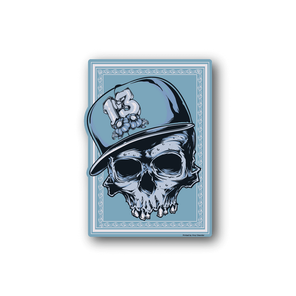 Skull vinyl sticker showing a skull in a blue hat holding flowers