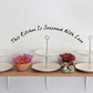Kitchen wall decal: "This kitchen is seasoned with love" cursive text