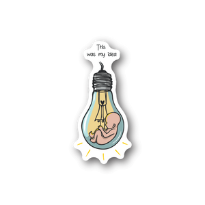 Baby vinyl sticker showing infant in bottle with bubble text "This was my idea".