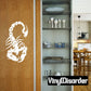 White threatening scorpion wall decal with raised claw and segmented tail on door