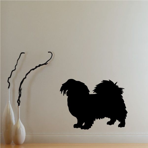 Black Tibetan spaniel dog silhouette wall decal with curled tail and raised fur.
