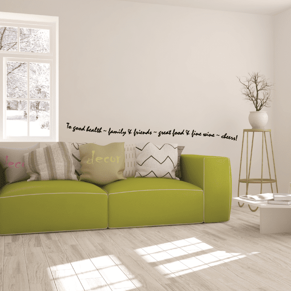 Black wall decal text: 'To good health, family & friends, great food & fine wine, cheers'
