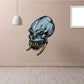 Toothy alien skull sticker with blue head and yellow grinning teeth