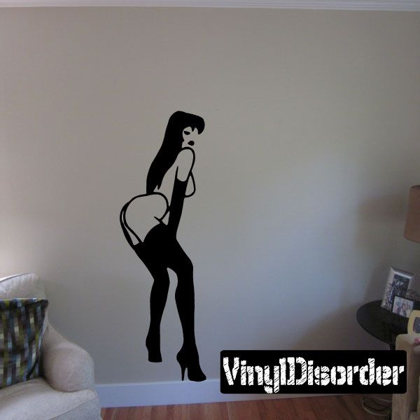 Silhouette wall decal of woman in thigh-highs and heels, holding a lollipop