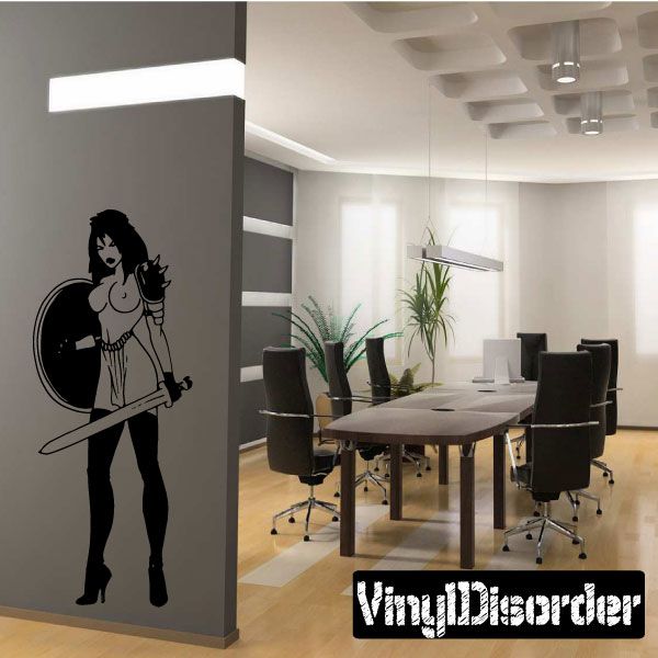 Warrior woman vinyl wall decal in black silhouette, standing with sword and accessories