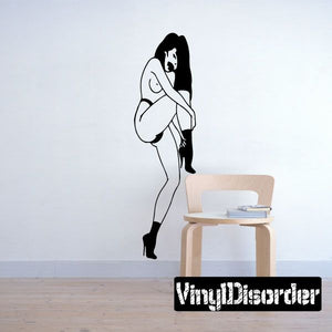 Woman fixing heels wall decal, black and white line art