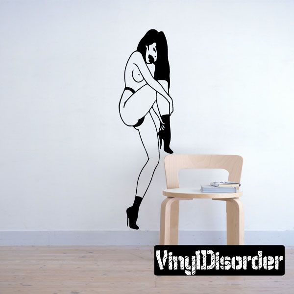 Woman fixing heels wall decal, black and white line art