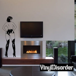Wall decal of a woman silhouette in short shorts and thigh-high boots