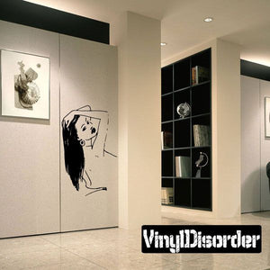 Hair-styling woman wall decal, black line art figure on light background