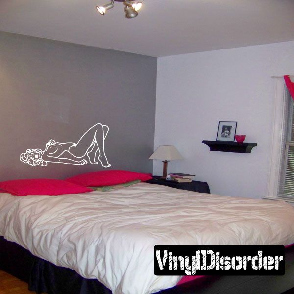 Arched-back figure wall decal, white outline silhouette on a wall