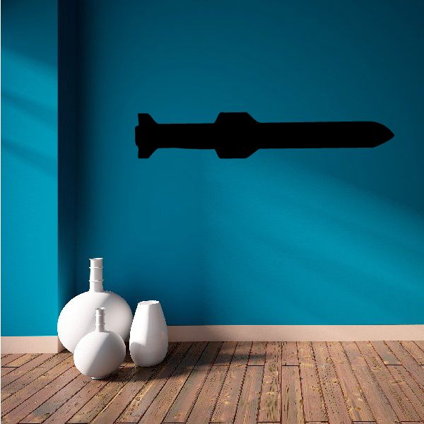 Torpedo-shaped decal with dark silhouette and pointed ends
