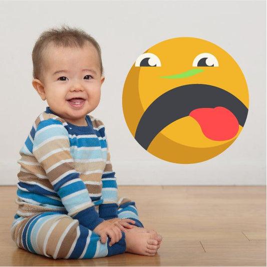 Tongue-out emoticon face wall decal with yellow face, black sunglasses, and red tongue