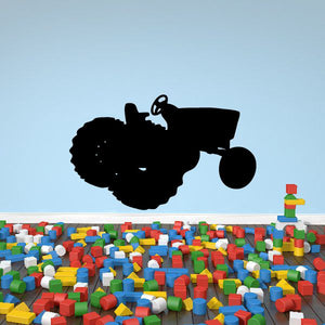 Black tractor silhouette decal with large front wheel and bucket