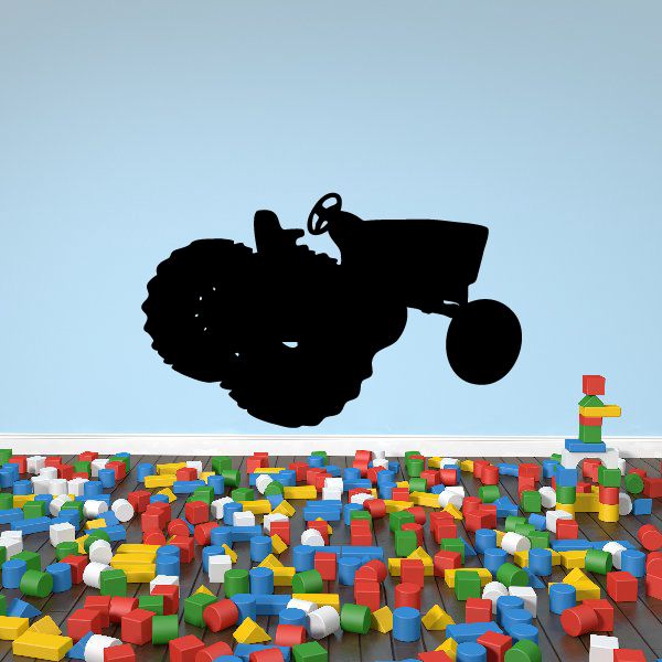 Black tractor silhouette decal with large front wheel and bucket