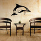 Black dolphin wall decal in traditional profile, fin and tail visible