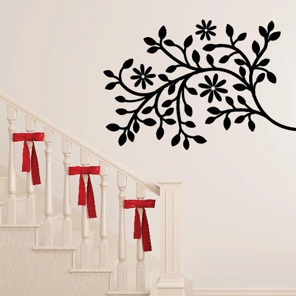 Tree branch wall decal with black floral blossoms and leaves