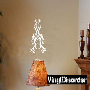 Tribal dancer decal with white ornate silhouette on a wall