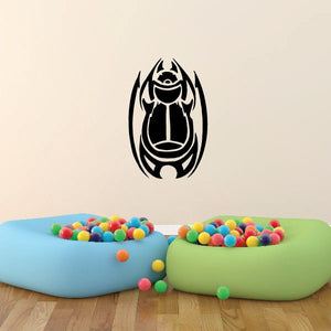 Tribal beetle decal with black tribal beetle emblem on white background