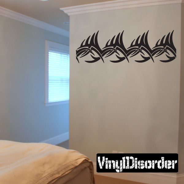 Tribal bracelet wall decal, black tribal pattern strip with five eye-like motifs.