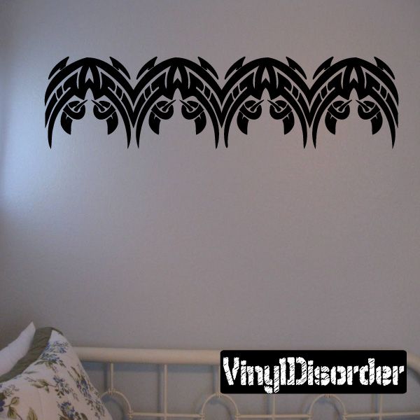 Black tribal bracelet wall decal with four stylized eye motifs, vinyl sticker