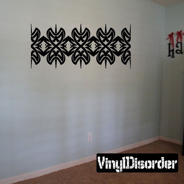 Tribal wall decal with black interlocking flame-like motifs strip