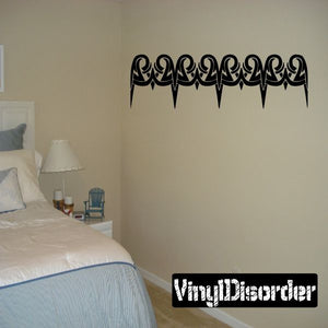 Black tribal wall decal border with swirling drip shapes for decorating walls