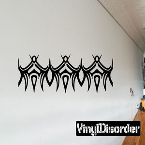Black tribal bracelet wall decal with repeating arches and dripping details