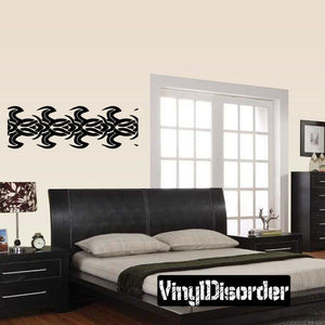 Black tribal wall decal with ornate swirled lettering design