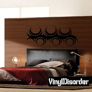 Tribal circular wall decal with dark crescent shapes and ornate linework