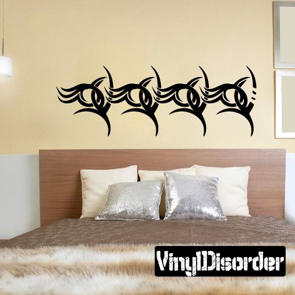 Black tribal wall decal with scrolling curved shapes and decorative swirls