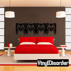 Tribal wall decal featuring a row of black ornate bat-like motifs