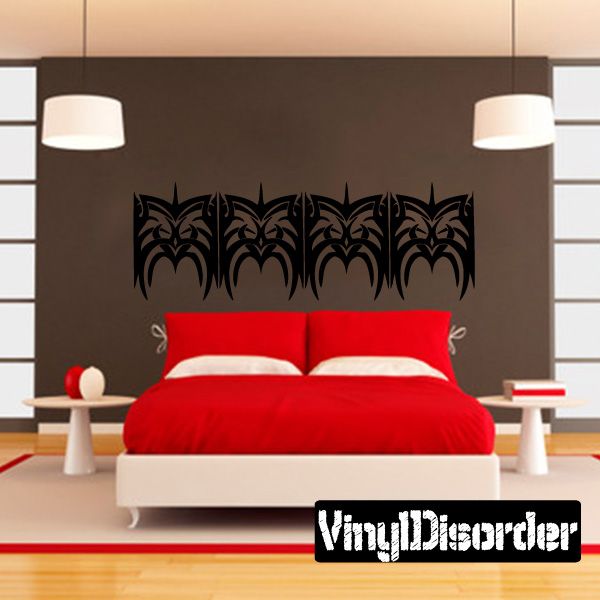Tribal wall decal featuring a row of black ornate bat-like motifs