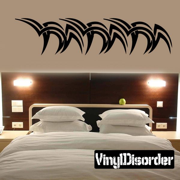 Tribal vinyl wall decal with black curved feather swirl design