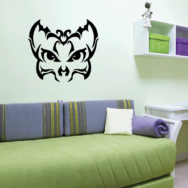Tribal skull wall decal with black bat-like design and carved facial features
