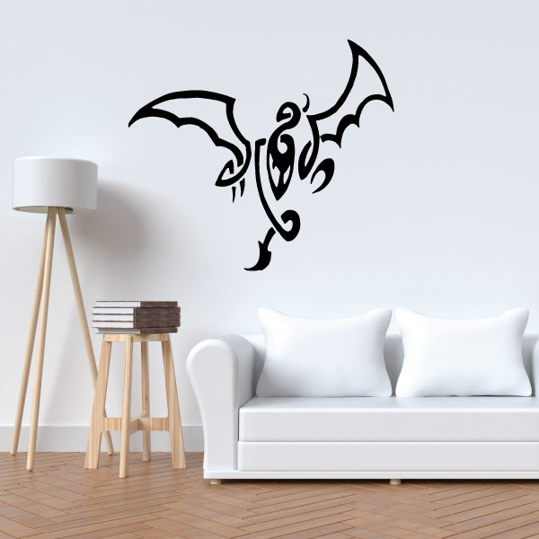Black tribal dragon wall decal with curved wings and tail flourish.