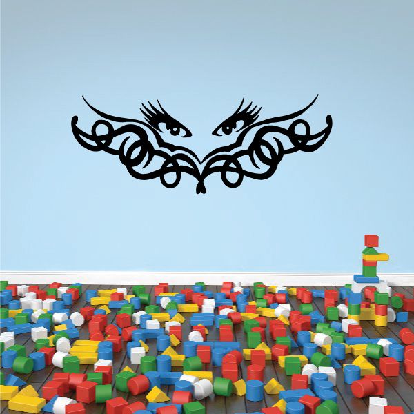 Tribal eyelash decal with symmetrical black eye mask and curled lash details