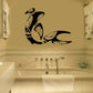 Tribal fin whale wall decal, black stylized whale silhouette with fin and tail.