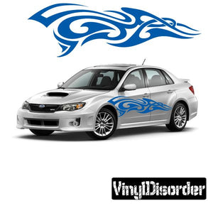 Tribal flame car decal with blue swirl design on the side of a silver vehicle