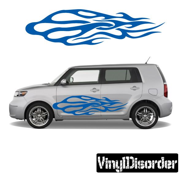 Blue tribal flames vinyl decal on a silver car side panel