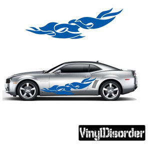 Tribal flames vinyl decal in blue, applied to a car door and hood
