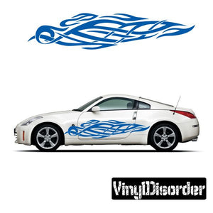 Vinyl car decal with blue tribal flame pattern on vehicle side