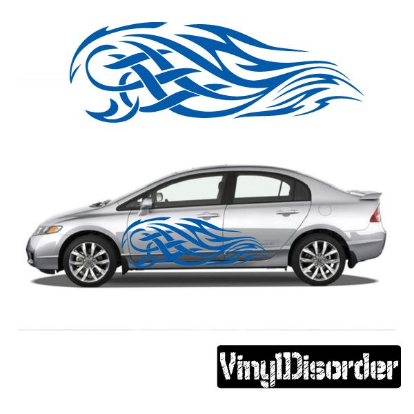 Tribal flame vinyl car decal in blue, applied along the side panel.