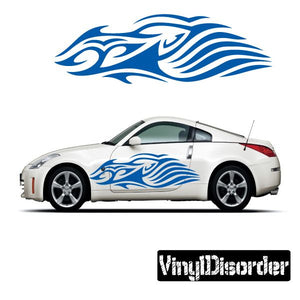 Tribal flame vinyl decal in blue, shown on a white car door and hood