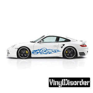 Blue tribal flame vinyl decal on side of white sports car
