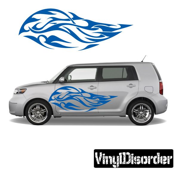 Vinyl tribal flame decal, blue flame graphic on a car side panel.