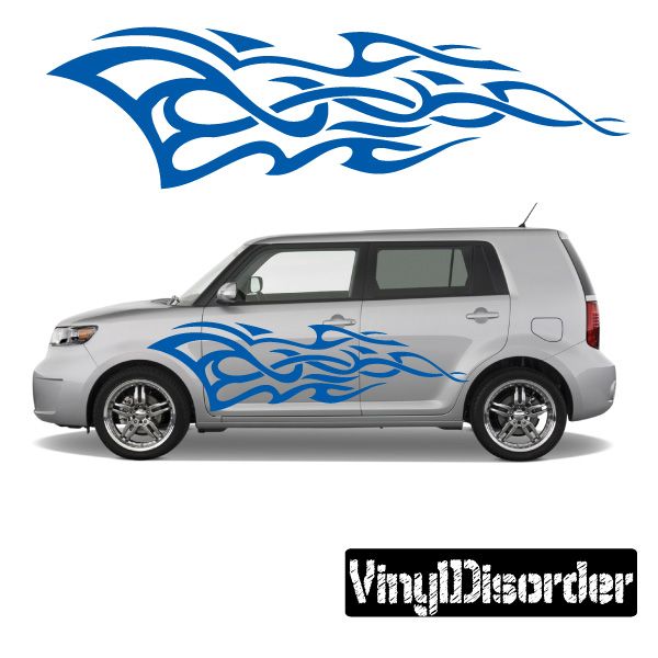 Tribal flame car decal in blue on a silver vehicle door and quarter panel